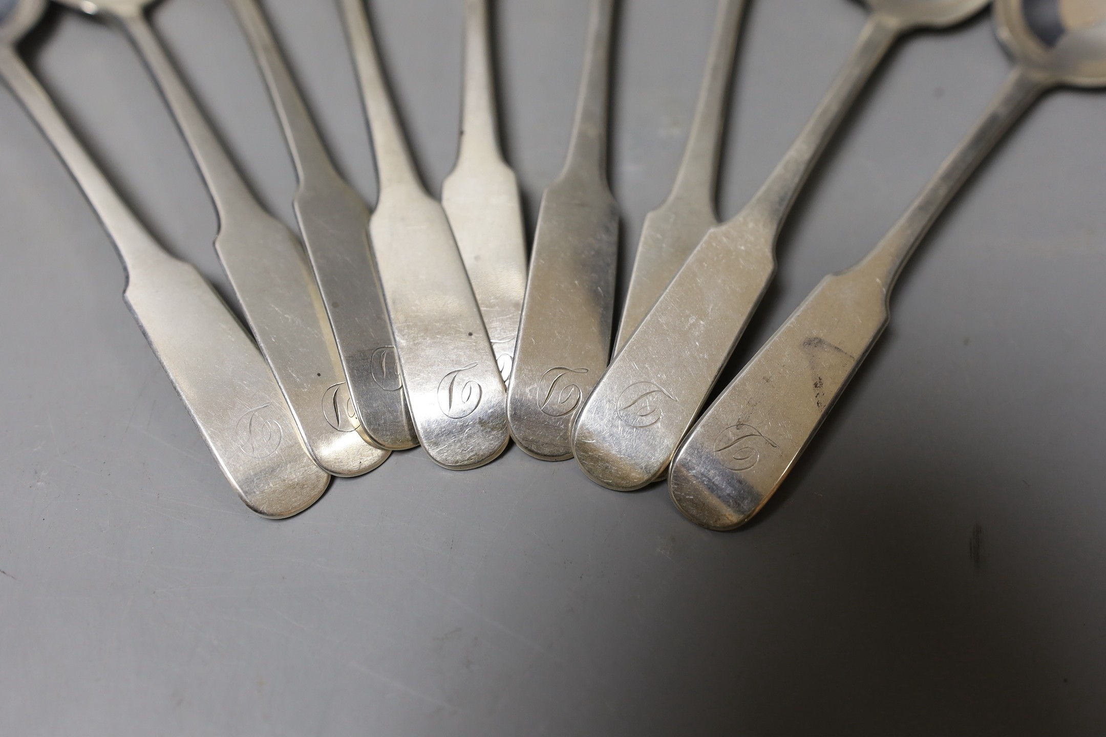 A matched set of nine George III and later Scottish silver dessert spoons, including Edinburgh, 1810(5) and 1839 (3), 8.4oz.